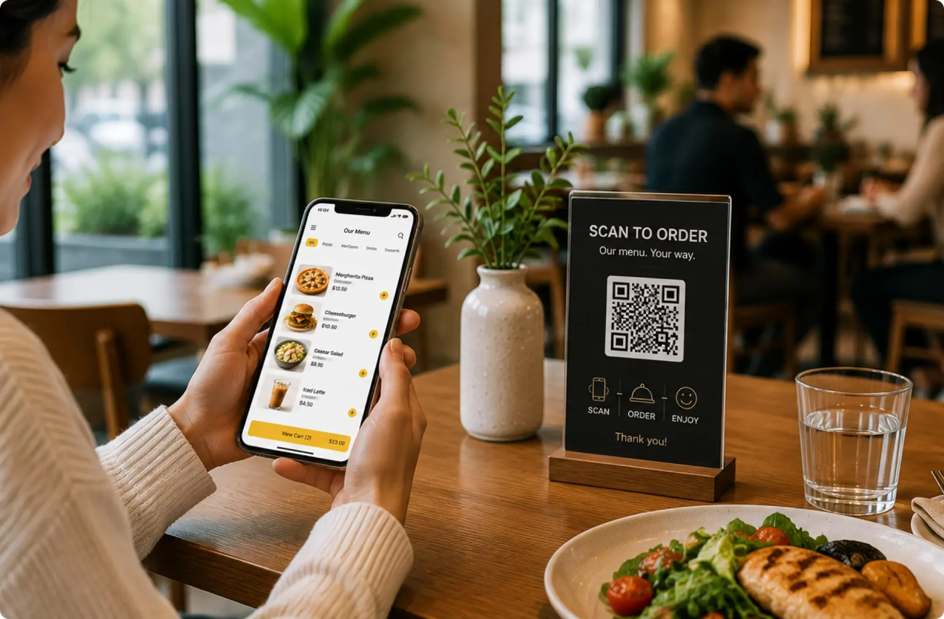 Diner scanning a QR code at a restaurant table
